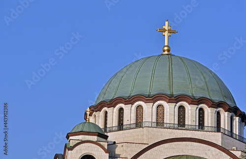 The Temple of Saint Sava (Sveti Sava) - Serbian Orthodox church with clear blue sky in the background. Shot in day time during the golden hour.