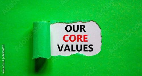 Our core values symbol. Words 'Our core values' appearing behind torn green paper. Beautiful green background. Business, our core values concept, copy space.