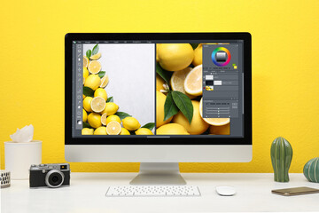 Designer's workplace. Computer with photo editor application on table