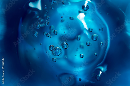 Abstract background of blue color bubbles in liquid. 