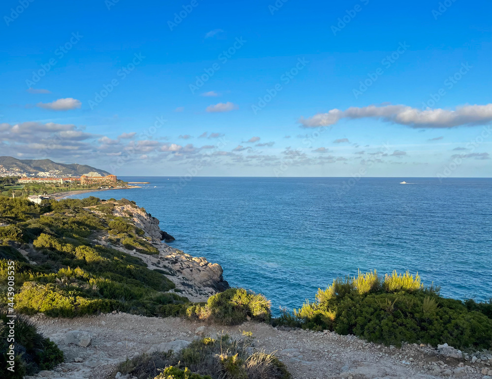 Panorama with sea view. Landscape on the coast from cliffs. Turquoise-colored water with the horizon in the background. Panorama with sea view. Landscape on the coast from cliffs. Turquoise-colored water with the horizon in the background.