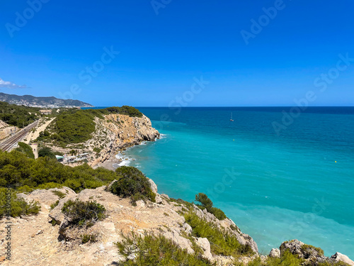 Panorama with sea view. Landscape on the coast from cliffs. Turquoise-colored water with the horizon in the background. © Bruno