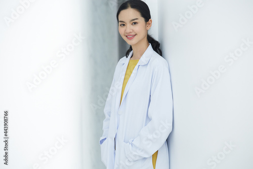 Portrait of young beauty doctor posing alone plastic surgeon's smiling happily and full of confidence after conducting the cosmetic surgery for her customer