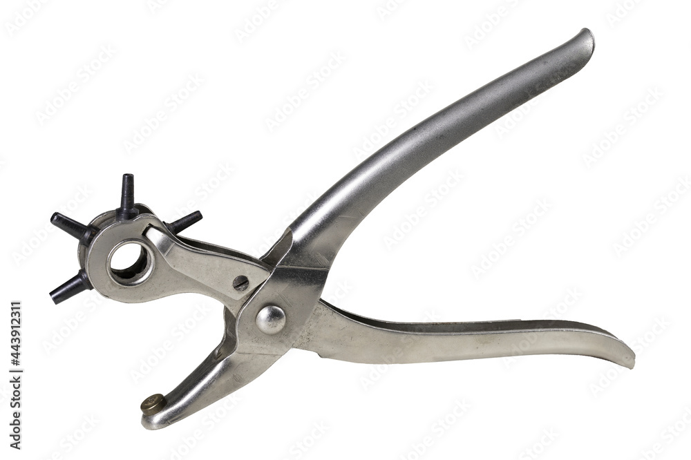 Device for making holes in a leather belt. Tools used in a leathercraft workshop. Device for making holes in a leather belt. Tools used in a leathercraft workshop.