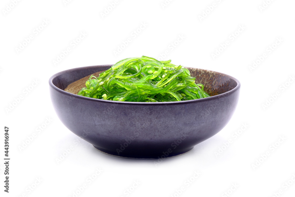 Chuka Wakame Salad in ceramic bowl isolated on white background. Famous Japanese appetizer Chuka Wakame Salad in ceramic bowl isolated on white background. Famous Japanese appetizer