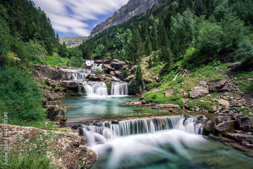 long exposure of Gradas De Soaso waterfall at Arazas river during summer, Ordesa National Park, Huesca, Spain photo