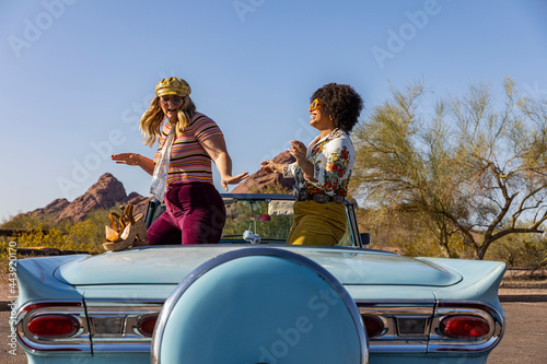 Two Friends Dancing in  Car looking out at Arizona landscape
