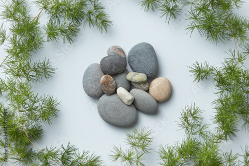 Closeup of small stones in circle of twigs