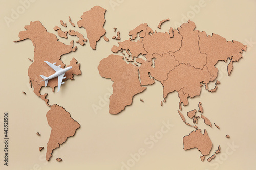 Plane miniature on map photo