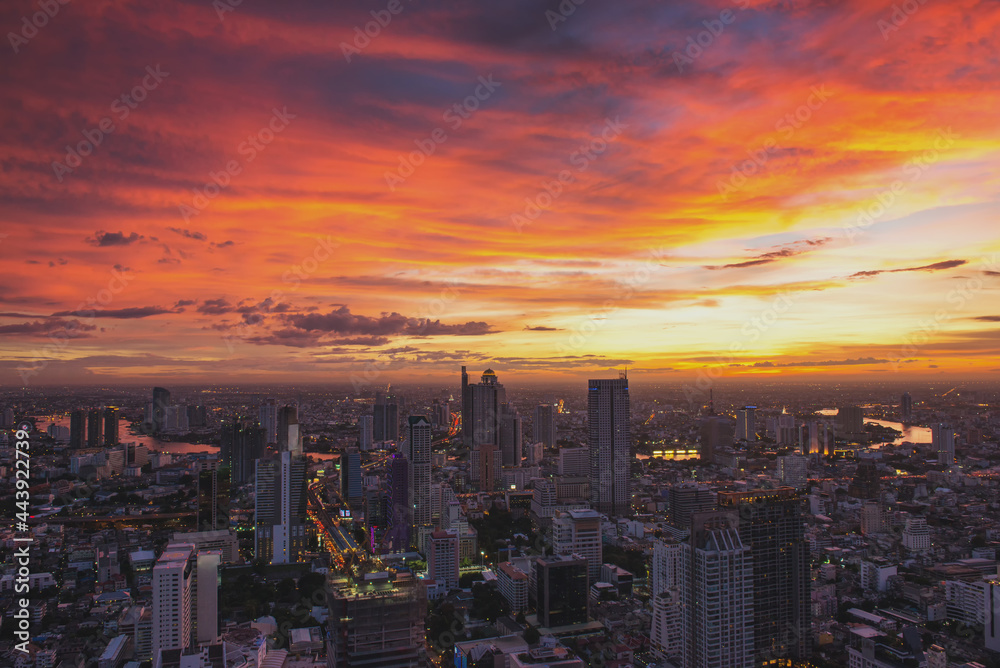 Bangkok city at sunset with Modern Business Building along the river. (Thailand)