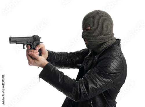 Man wearing knitted balaclava with gun on white background © New Africa