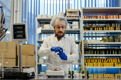 Cosmetic chemist creating products in laboratory  photo