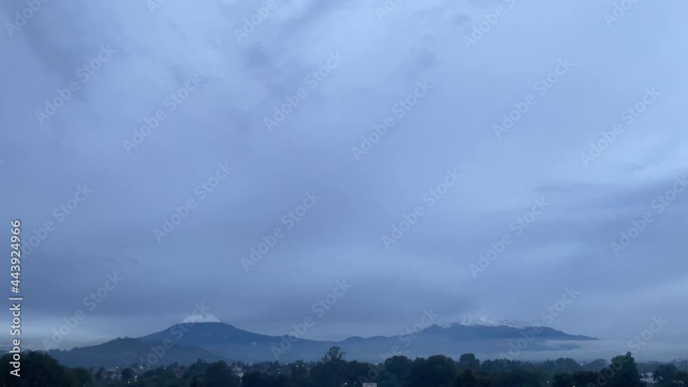 Mexican volcanoes in cloudy day, dusk, mountainous landscape Mexican volcanoes in cloudy day, dusk, mountainous landscape