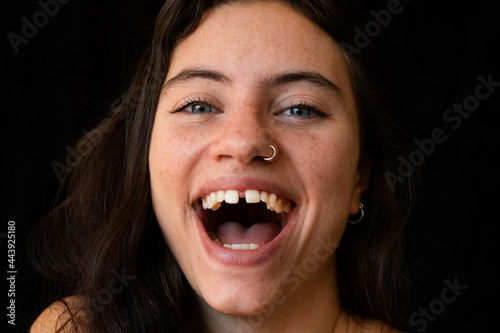 close up of a beautiful woman smiling with diastema