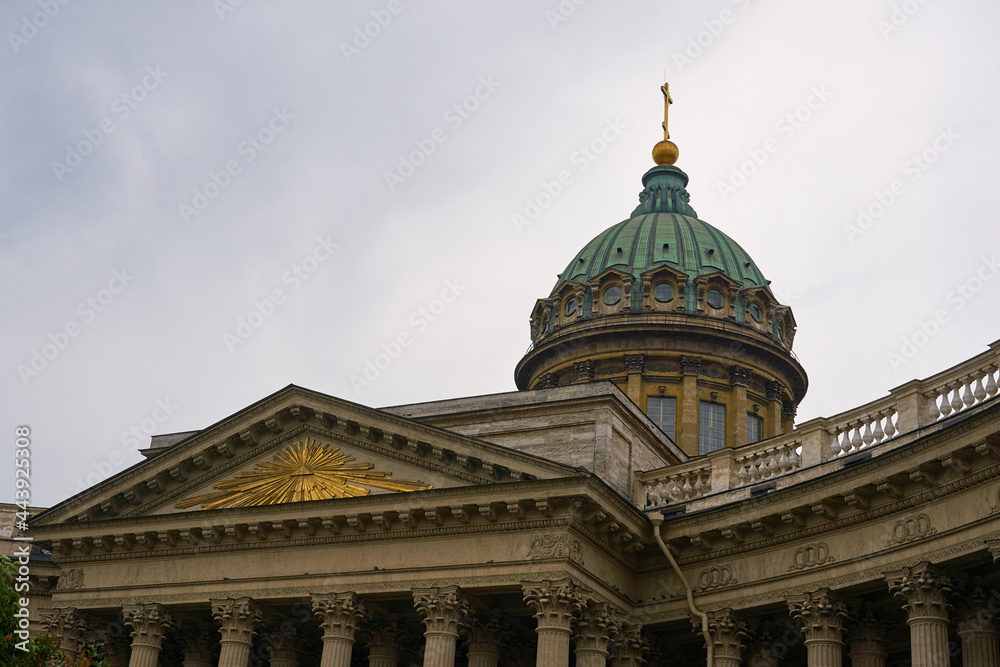 The dome of Kazan Cathedral with a cloudy sky in the background.