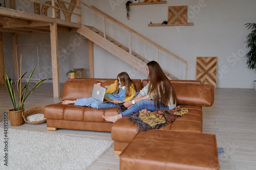 Elementary school girl with mother doing her homework