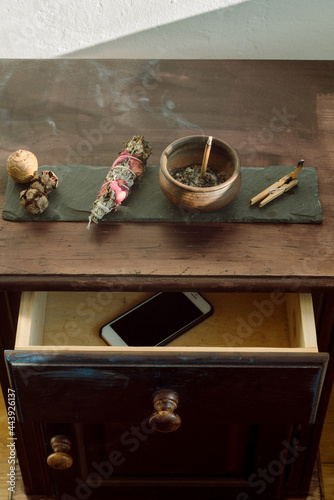 Incense smolders in a pottery on the table 