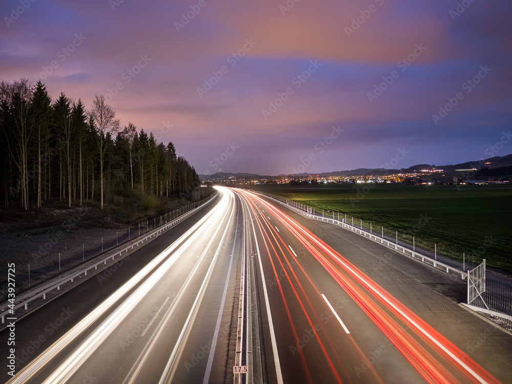 Light trails on a busy highway at rush hour Light trails on a busy highway at rush hour