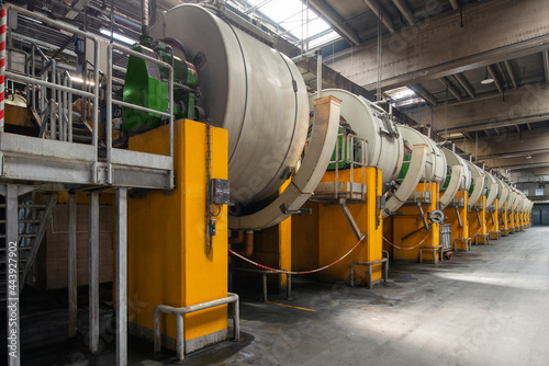 Schilderij op canvas Tannery. Large metal barrels for leather dyeing
