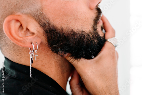 Portrait of moden man wiearing piercings photo