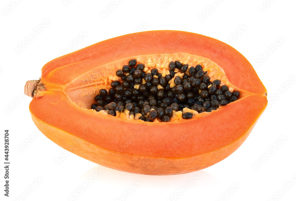 Half of ripe papaya fruit with seeds isolated on white background Half of ripe papaya fruit with seeds isolated on white background