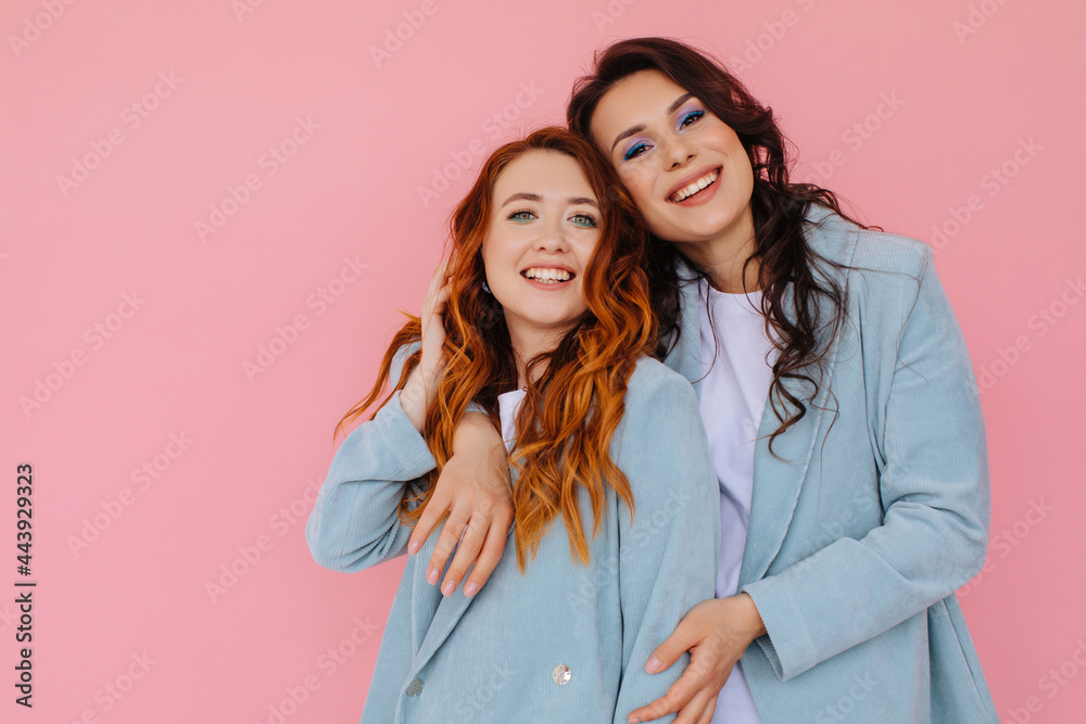 Happy hugging women 