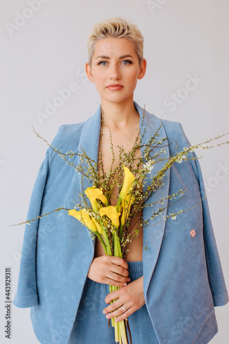 Fashion portrait with yellow flowers  photo