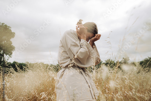Emotional portrait of a woman in the field