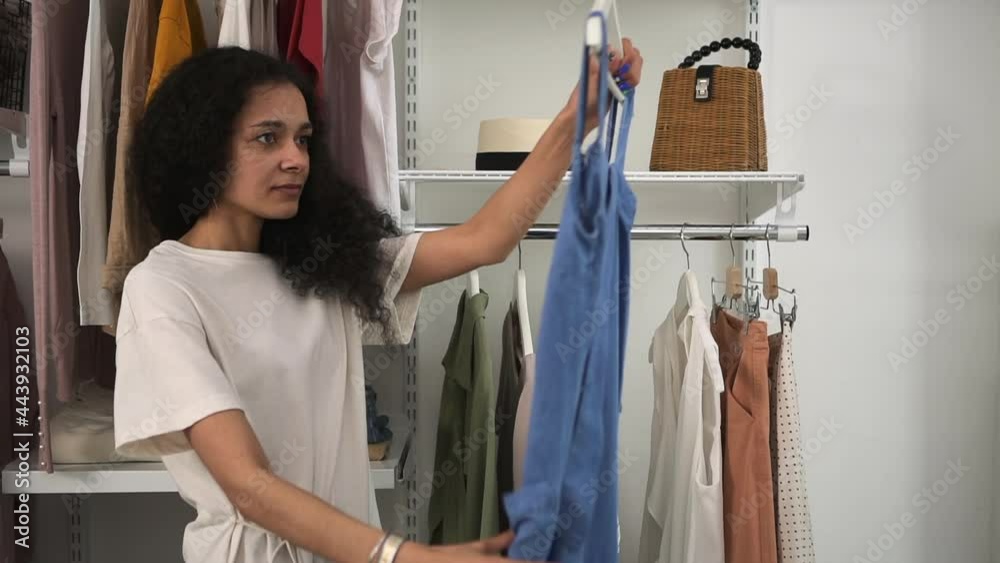 Wardrobe ore closet for woman Spring capsule wardrobe checkup black woman looks at clothes Spbd