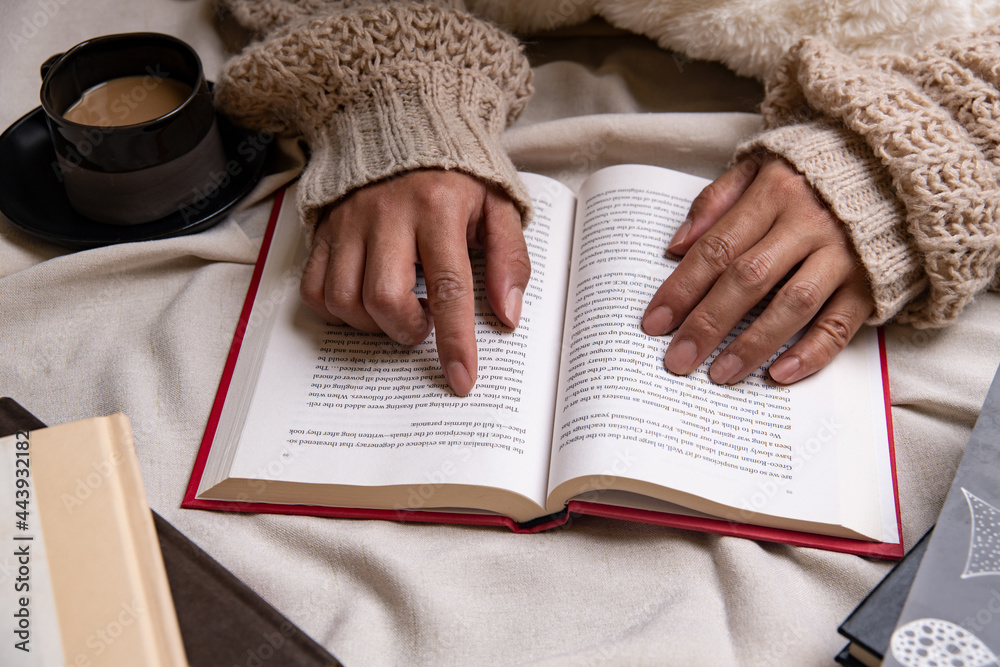 Naklejka premium reading a book in bed
