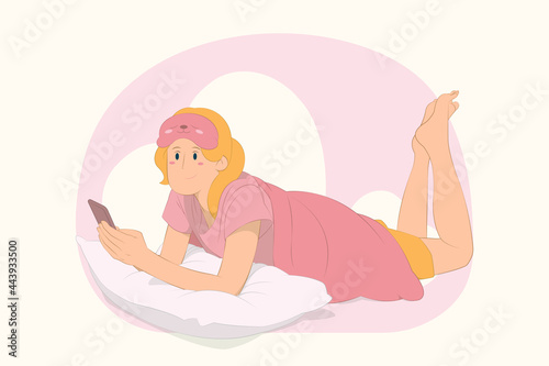 Young girl lies wrap cover blanket duvet use mobile cell phone concept