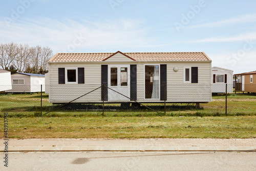 Modern mobile home behind fence