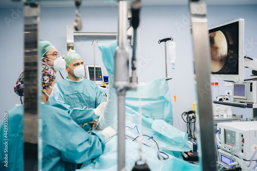 Doctors working in an operating room photo