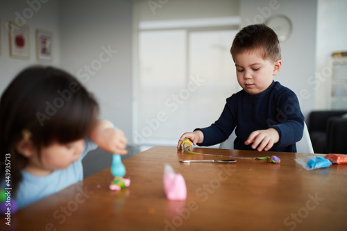 Mixed Race Chinese Siblings Play With Play Dough Together
