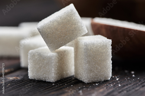 Sugar cubes on a wooden background