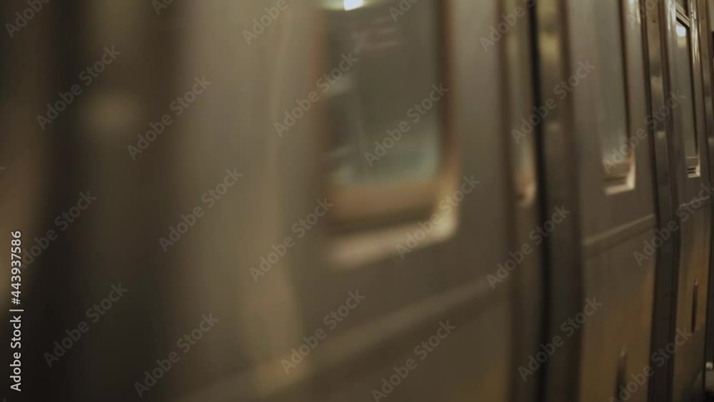 Subway car doors swish by and subway exits frame, shallow depth of field, long lens Subway car doors swish by and subway exits frame, shallow depth of field, long lens