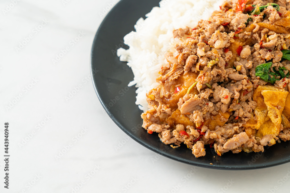 stir-fried minced pork with basil and egg topped on rice stir-fried minced pork with basil and egg topped on rice