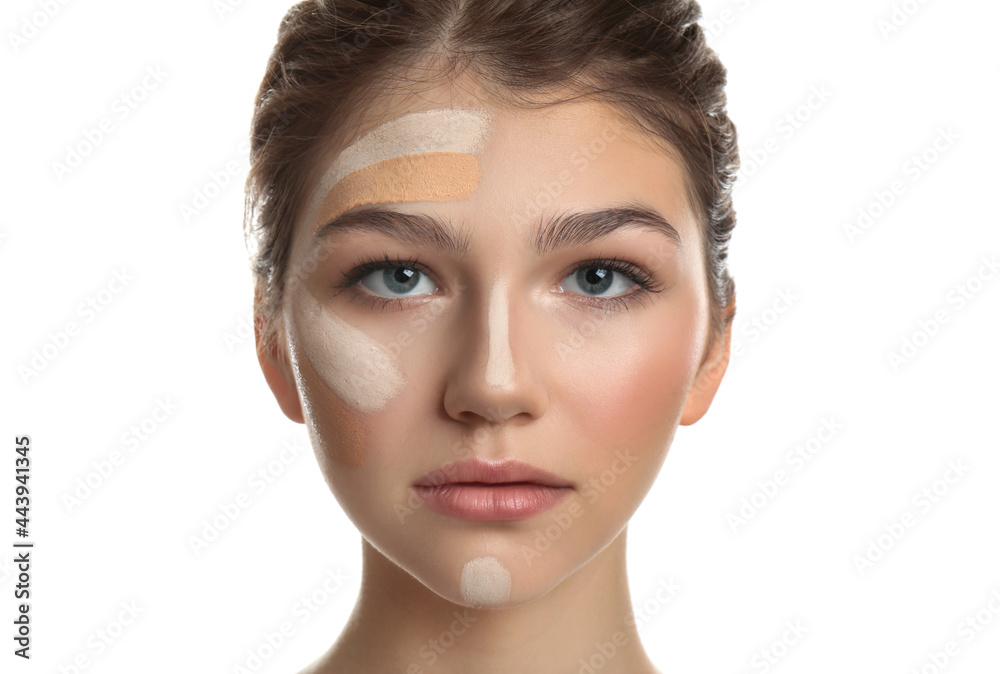Beautiful girl on white background. Using concealer and foundation for face contouring Beautiful girl on white background. Using concealer and foundation for face contouring