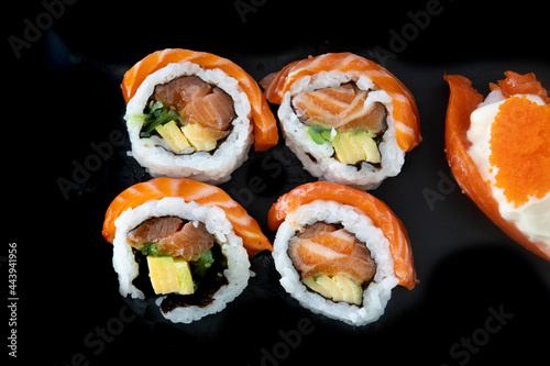 Salmon Maki Roll Sushi on a black plate