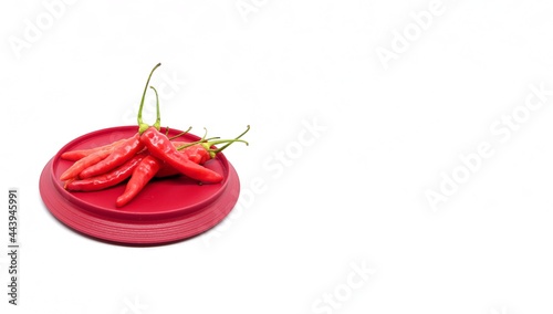 fresh red chili pepper on white background and big blank space. copy space, wide banner, food photography.