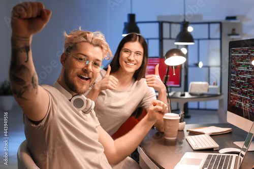 Happy young programmers wor...