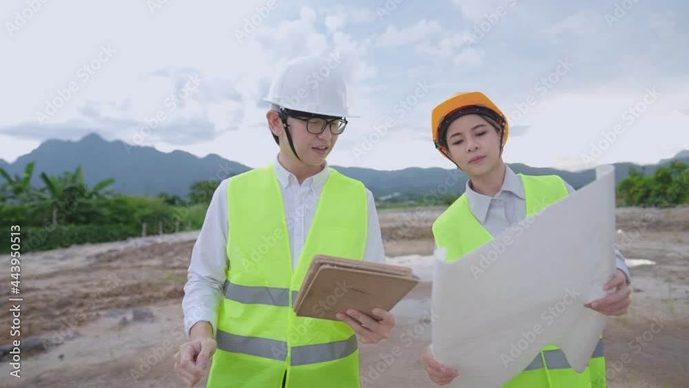 Asian Engineer architecture wear safety working gear discussing on project at outdoor construction site, wear safety vest and safety helmet, brainstorm teamwork colleague working with responsibility Asian Engineer architecture wear safety working gear discussing on project at outdoor construction site, wear safety vest and safety helmet, brainstorm teamwork colleague working with responsibility
