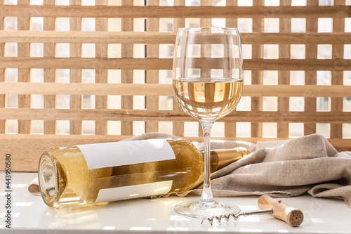 White wine glass and bottle...
