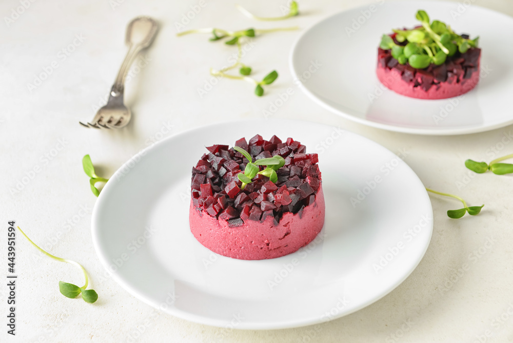 Plates with tasty tartare salad on light background Plates with tasty tartare salad on light background