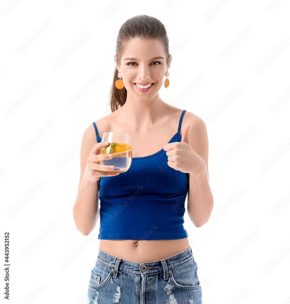 Young woman with fresh lemonade showing thumb-up on white background Young woman with fresh lemonade showing thumb-up on white background