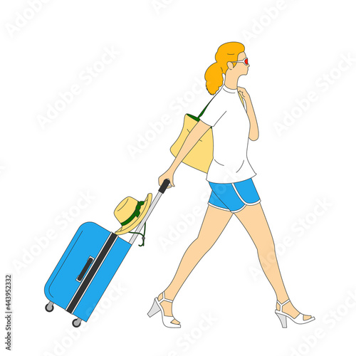 Young woman with suitcase and handbag