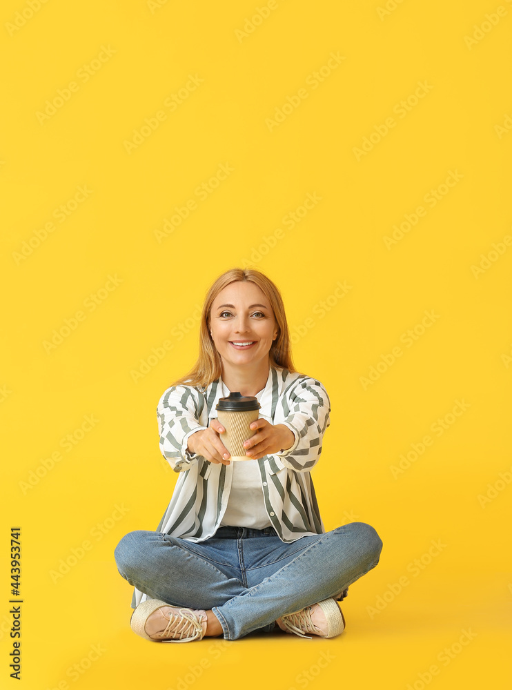 Beautiful mature woman with cup of coffee on color background Beautiful mature woman with cup of coffee on color background