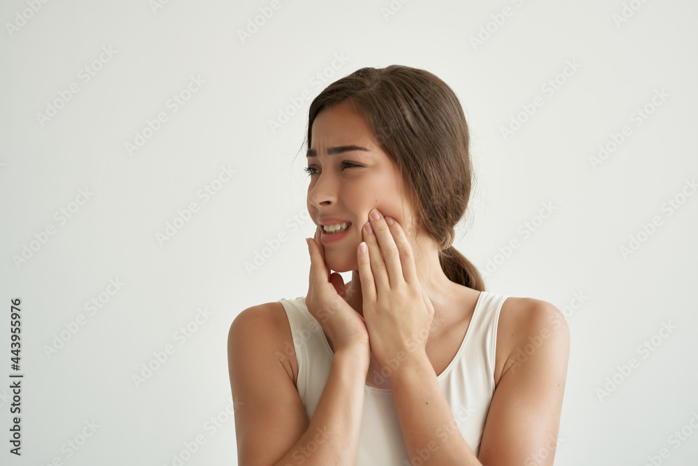 woman with toothache holding her face discomfort dentistry woman with toothache holding her face discomfort dentistry