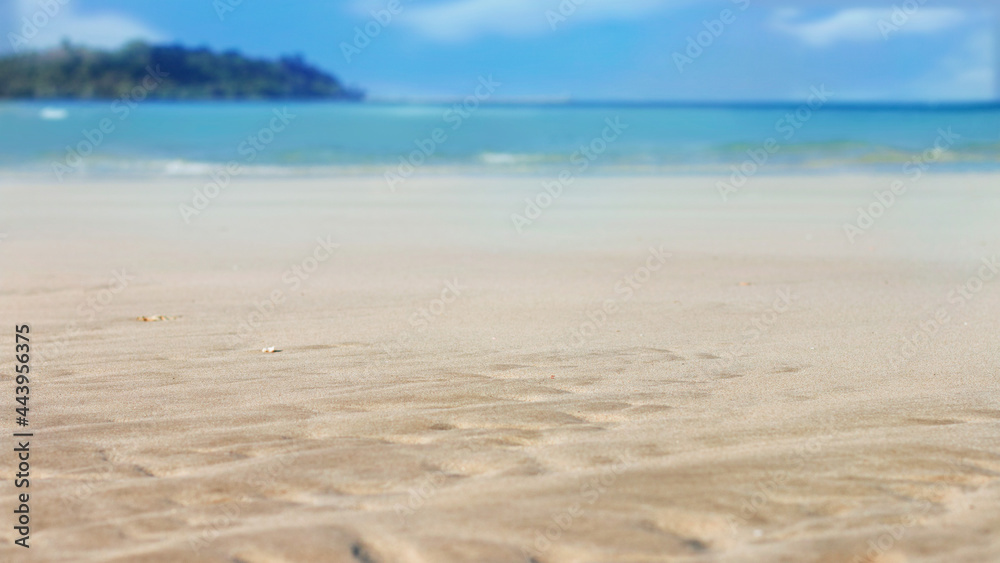 Fototapeta premium Soft sand on tropical beach and blue sea with summer sky.
