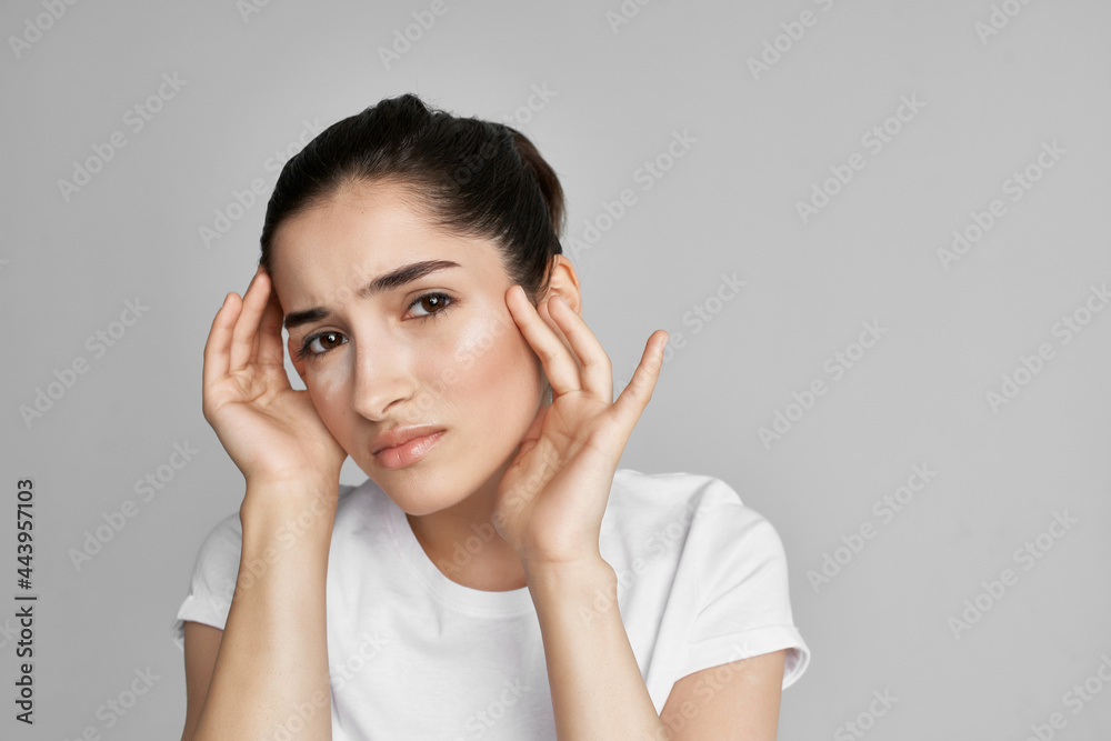 woman with headache dissatisfaction health problems medicine light background woman with headache dissatisfaction health problems medicine light background